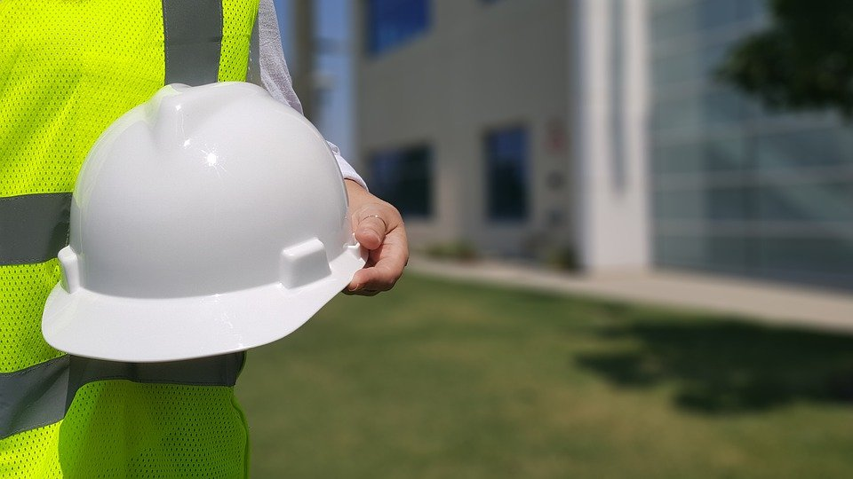a person holding hard hat