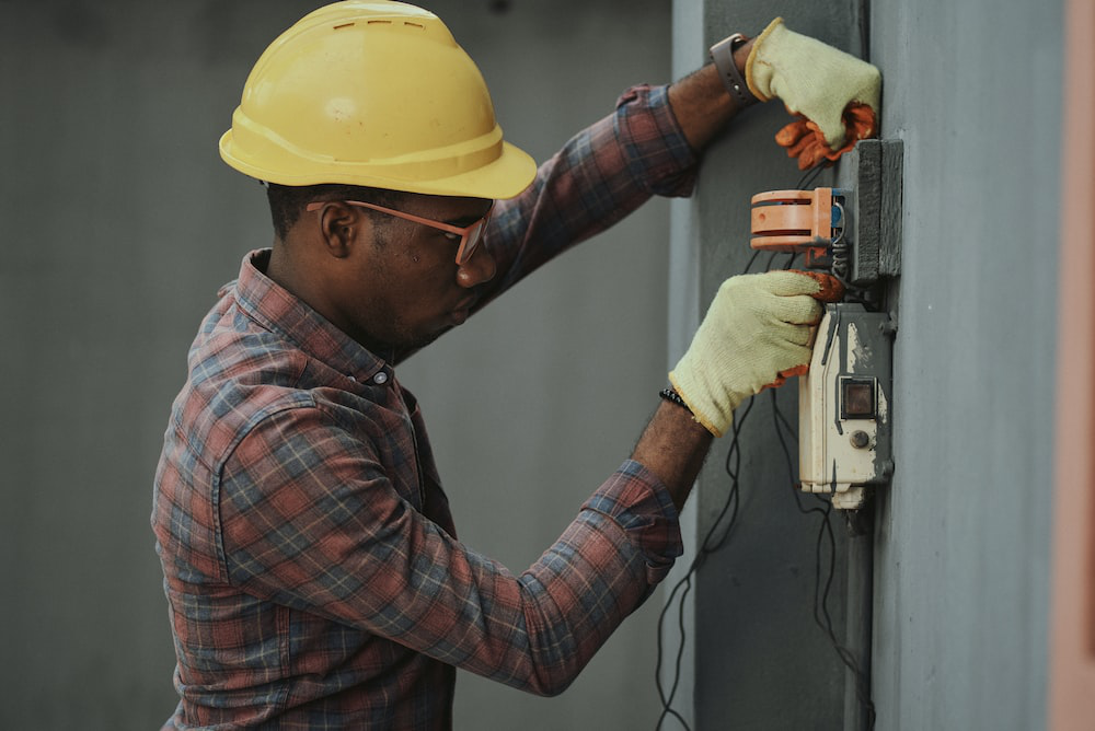 Person checking electrical wires