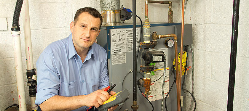 A technician fixing a hydronic system